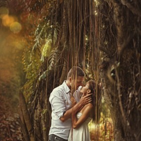 couple kissing in mysterious forest (bali, indonesia)