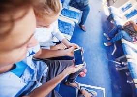 couple using smart phone in a bus. Template for an app design
